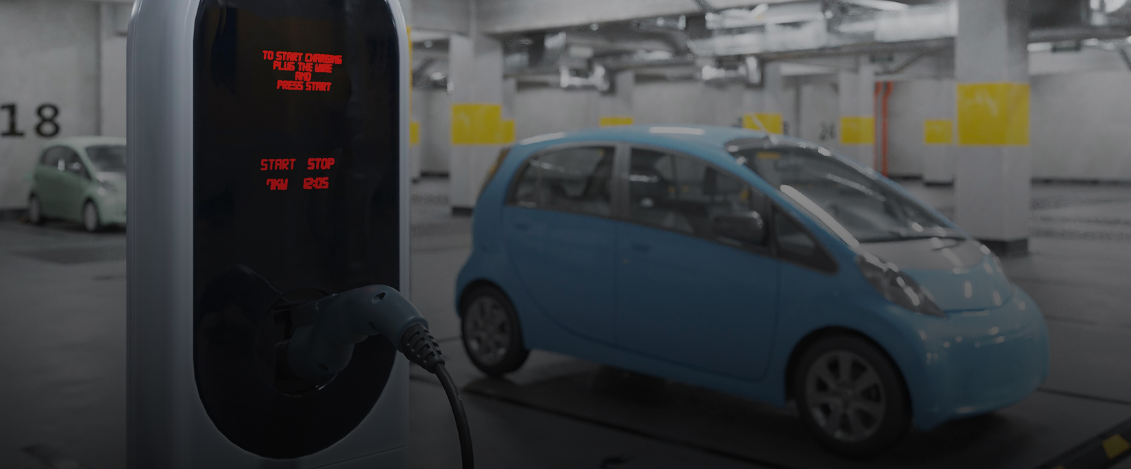 EV Charging Infrastructure with Blue Electric Car and Charging Station